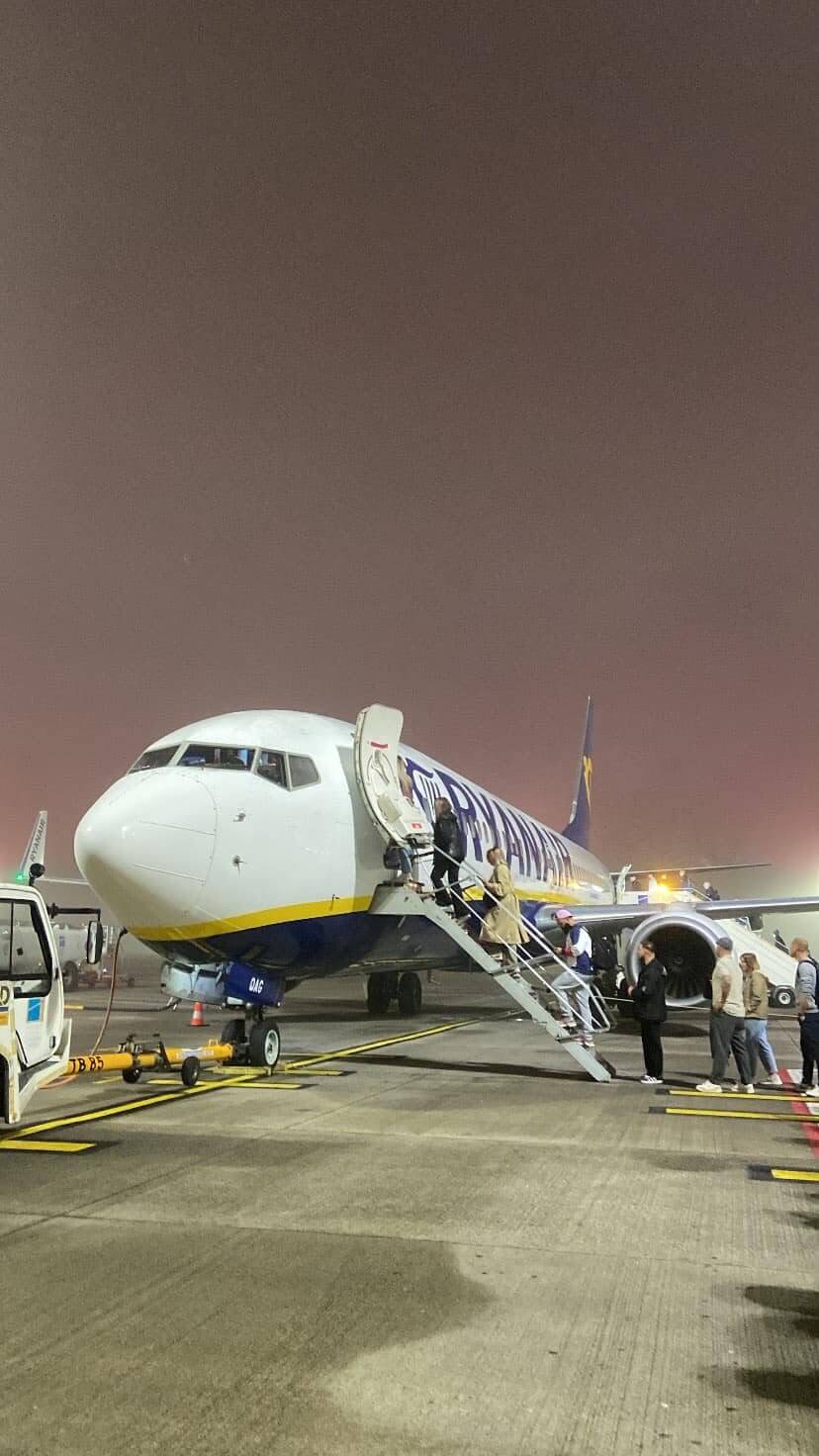 Airplane at sunset at Brussels Airport in Belgium