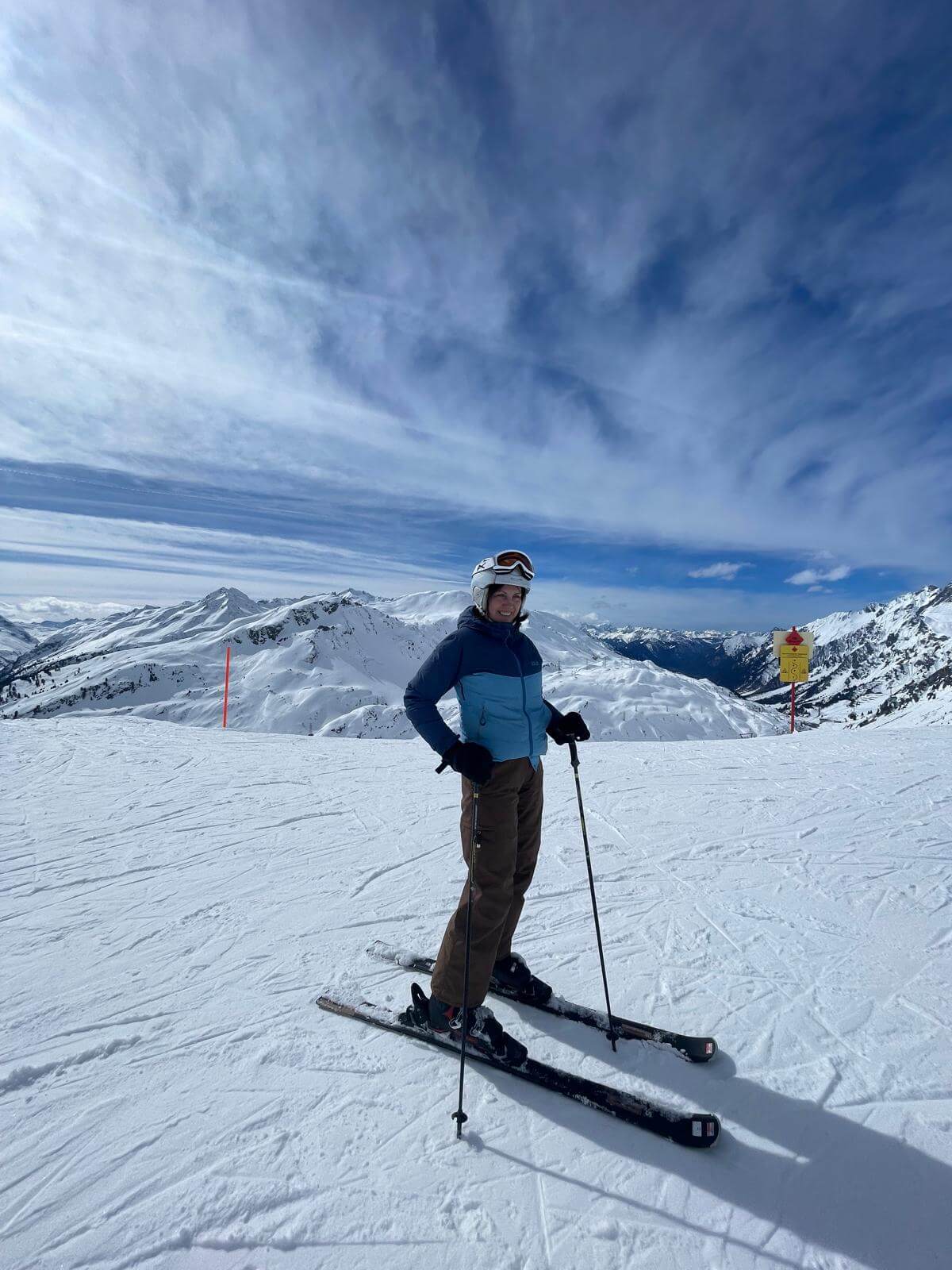 My mum skiing on the slopes during a ski trip in Europe
