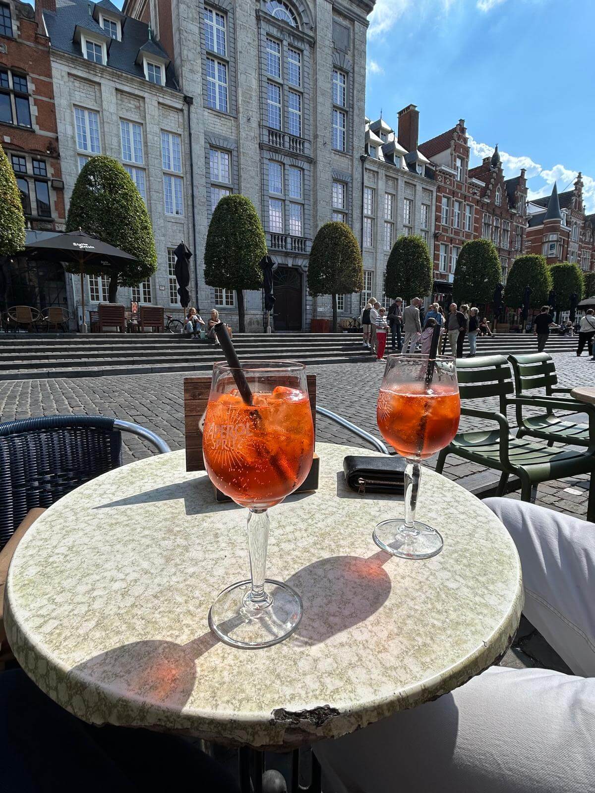 Aperol Spritz on a sunny terrace at Oude Markt Leuven
