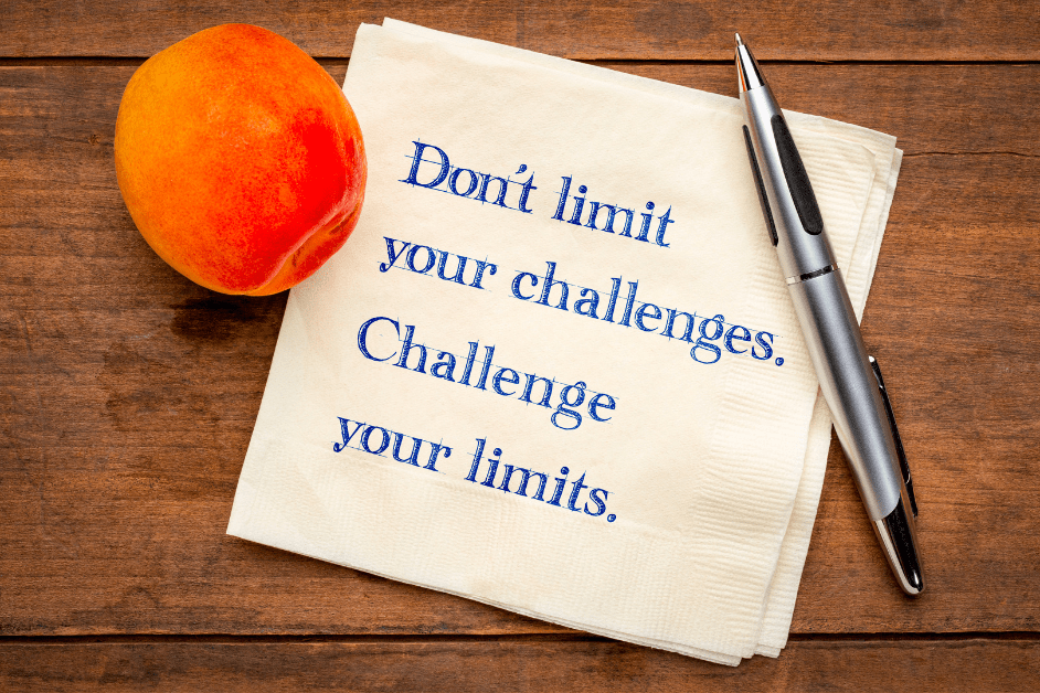 Life Challenges You Must Conquer - wood background with note and apple