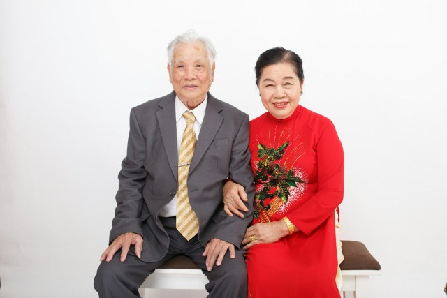 A man and a woman sitting on a bench