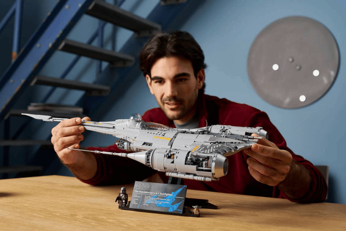 Man holding the LEGO Star Wars Mandalorian N-1 Starfighter