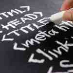 Write code with chalk on a blackboard