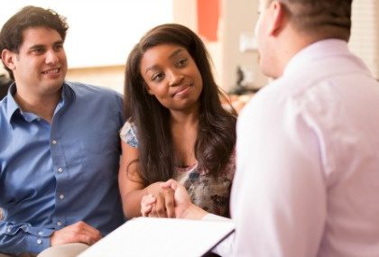 Potential adoptive mom shakes the social workers hand during a home study visit
