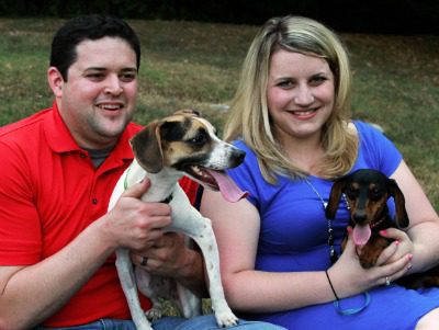 Colby and Sarah with their dogs Adoptive parents Colby and Sarah with their dogs
