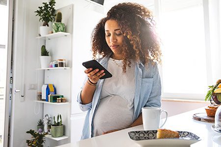 Birth mother gets ready to call an adoptive couple