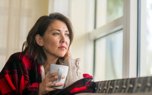 Hopeful adoptive mom looking out the window