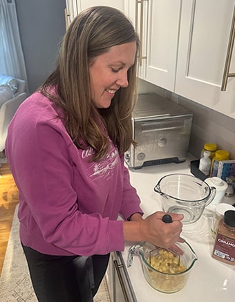 Hopeful adoptive mom Emily baking in her Virginia home