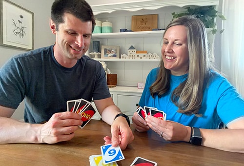 Bob and Emily enjoying a fun game of Uno together in their Virginia home