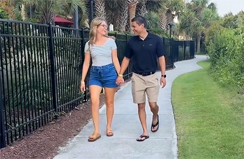 Rachel and Evan, hopeful adoptive parents in Pennsylvania, share a laugh while walking hand-in-hand