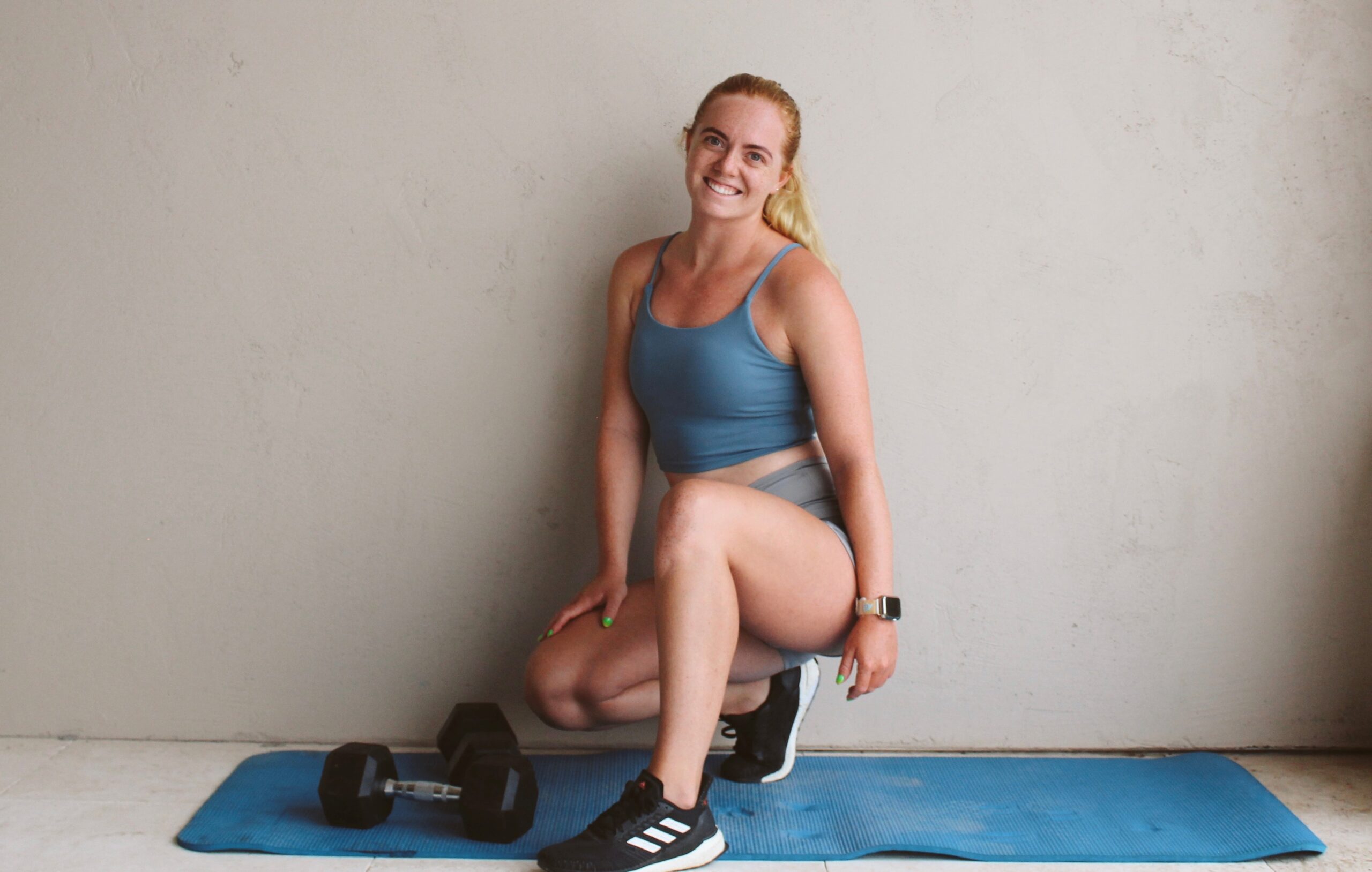 posing with dumbbells