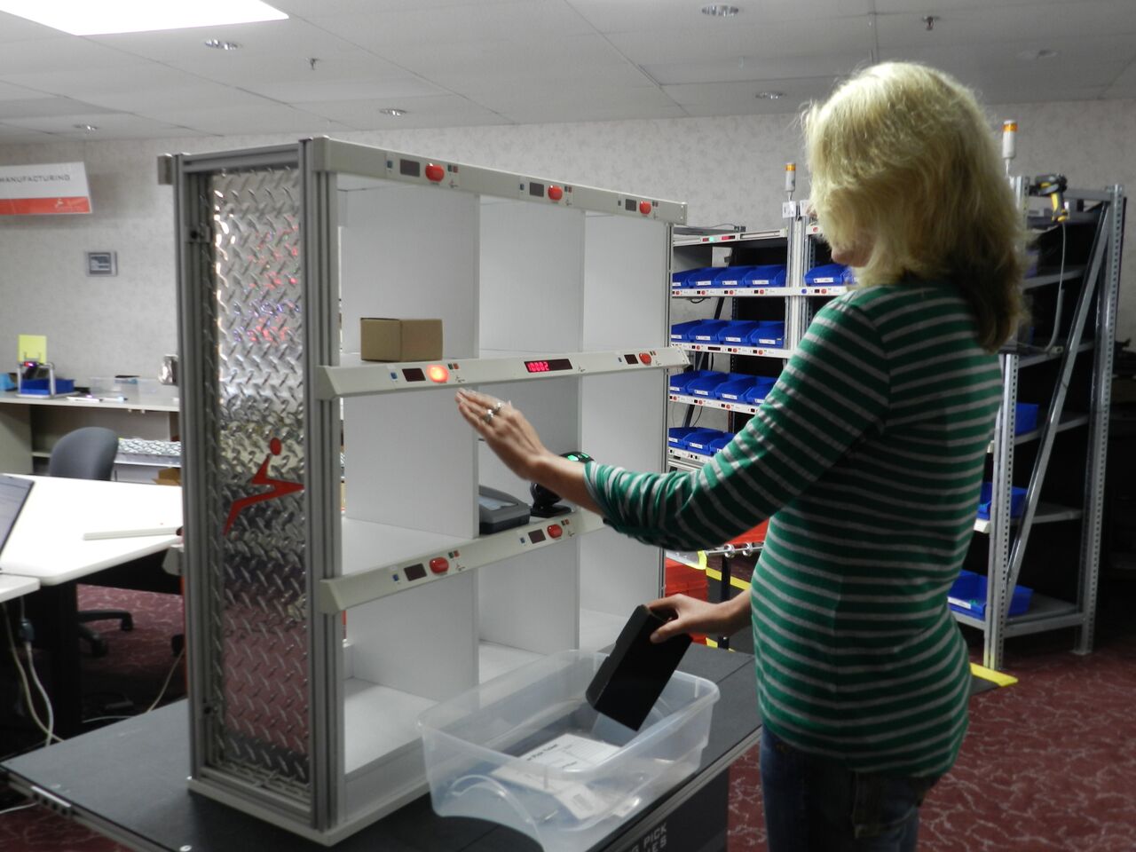 Automated Order Fulfillment Sortation with Two-Sided, Light-Directed LP Put  Wall System ProMat 2015. - Lightning Pick