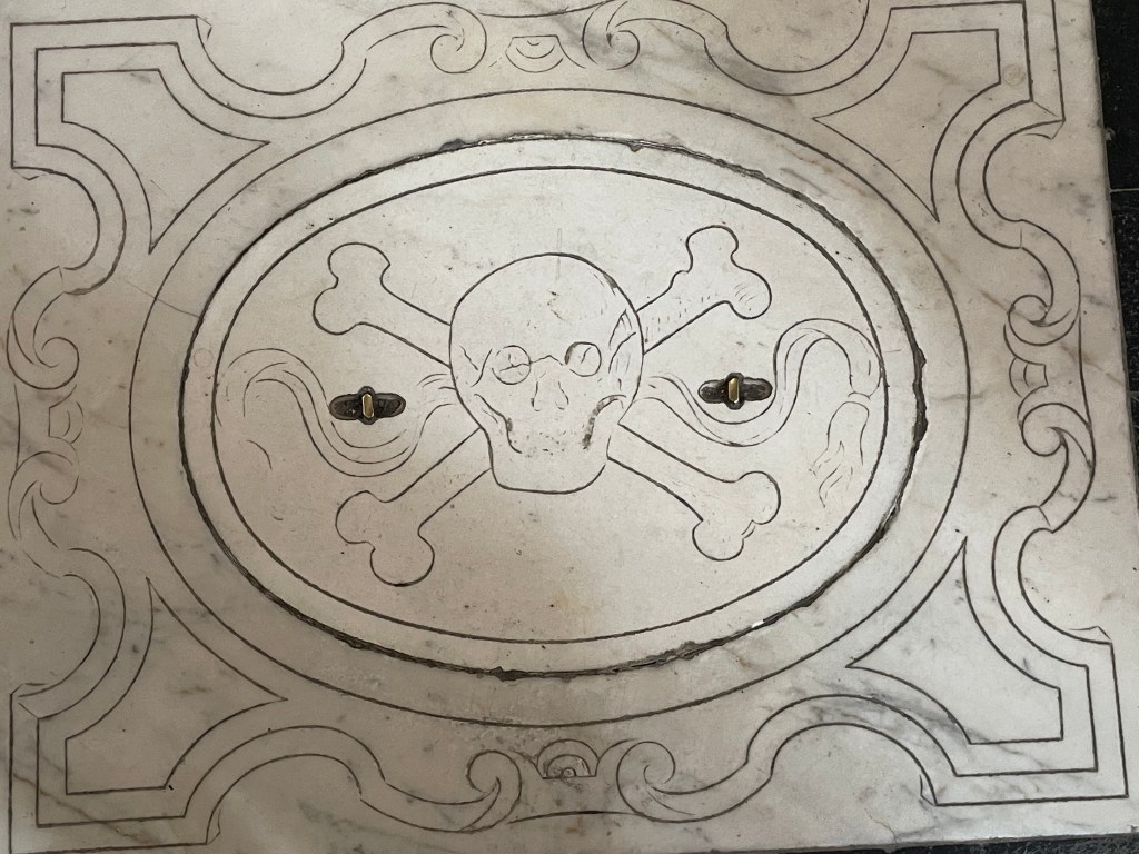 Skull and crossbones in the floor of Santa Croce basilica, Florence