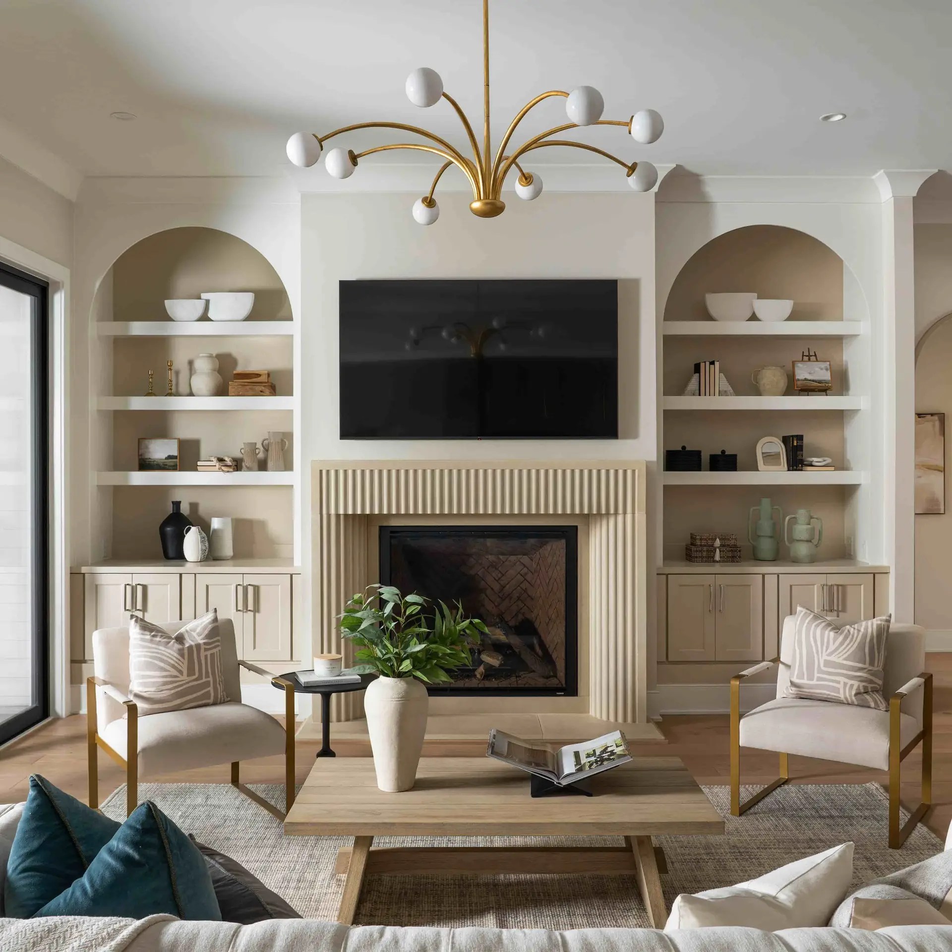 Living room with fireplace and built-in shelves