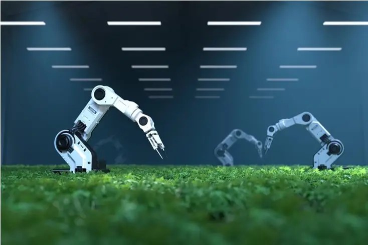 Robotic arms operating under artificial lighting, illustrating innovation in AI and emerging technologies