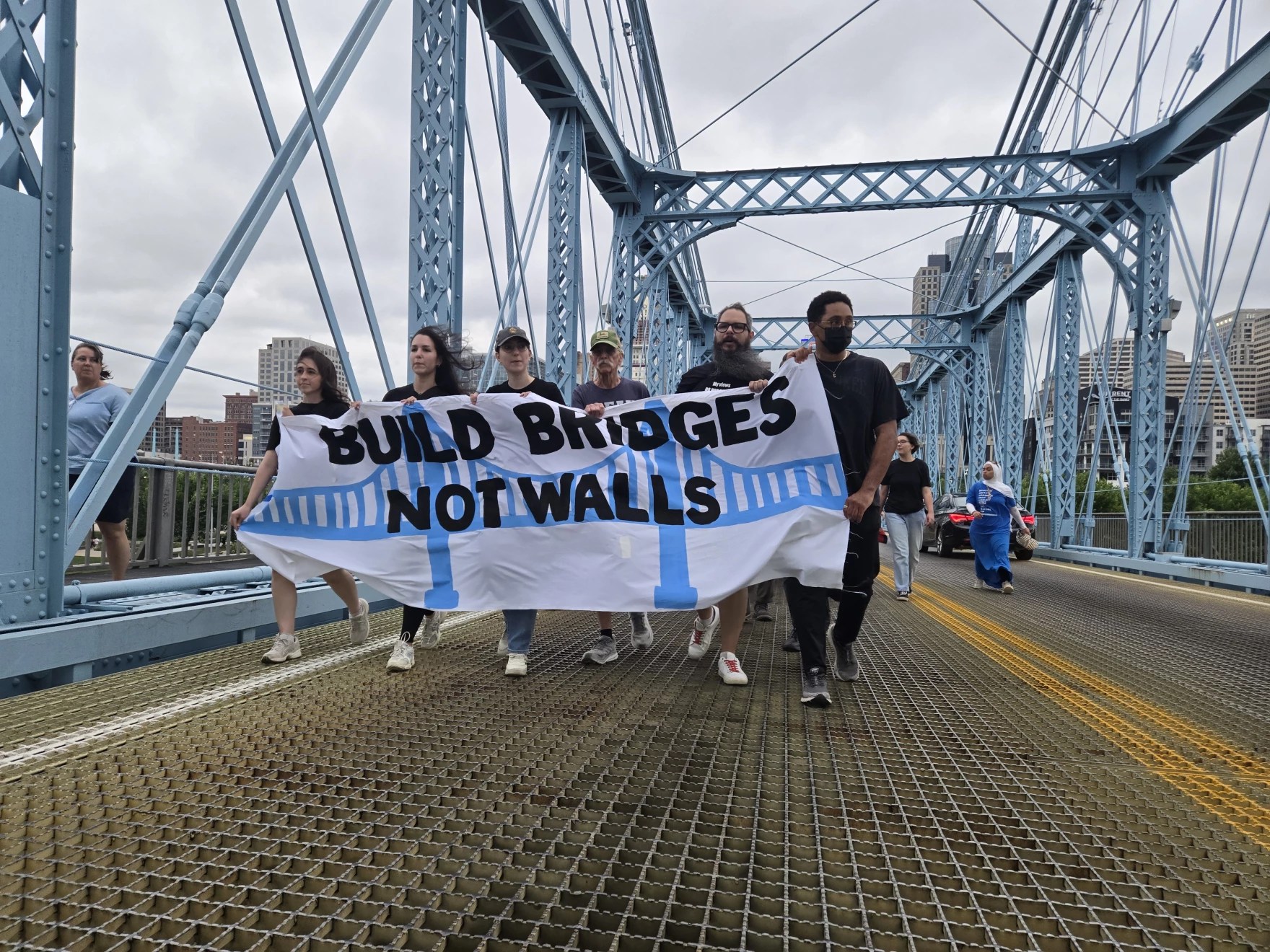 Police arrest 13 after being met with ‘hostility’ during protest on Roebling
