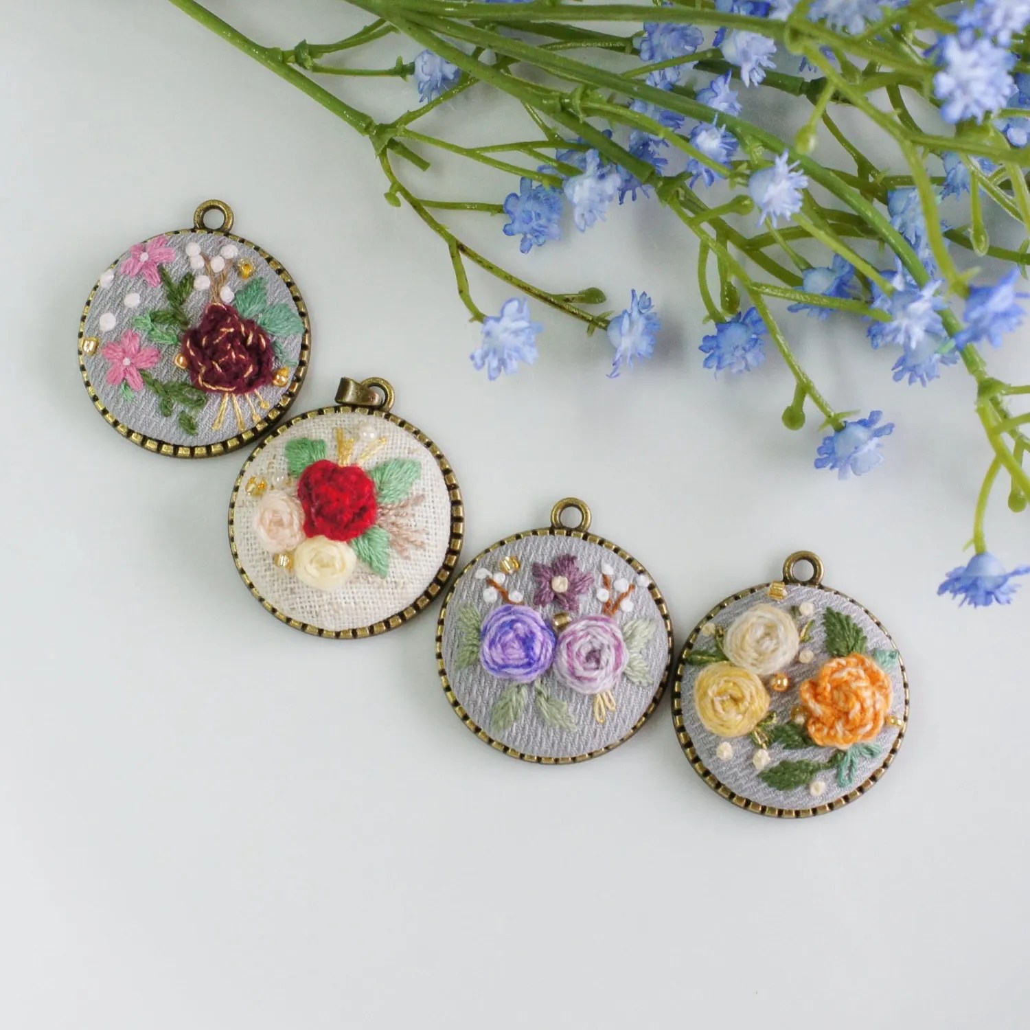 Roses embroidered pendants