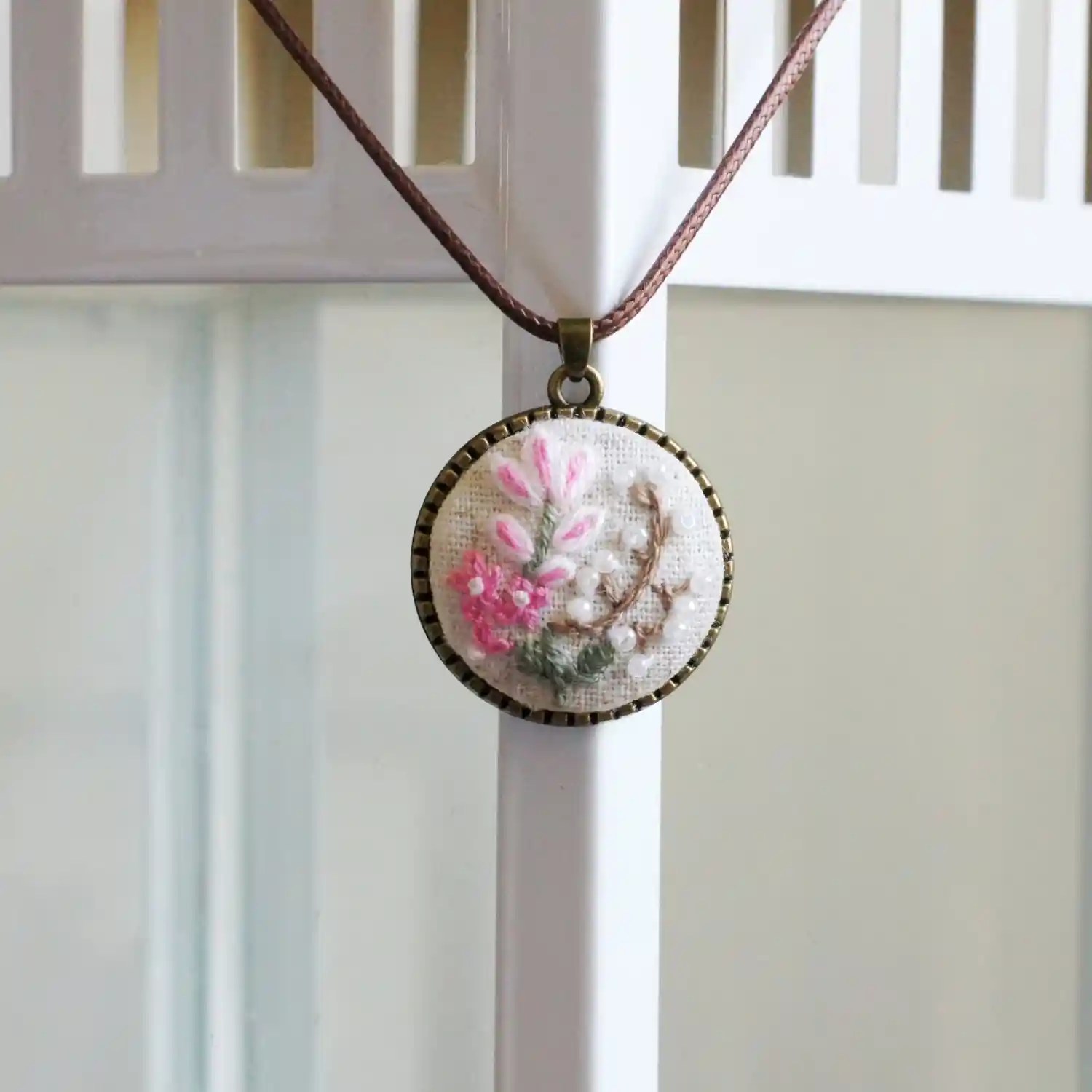embroidered pink floral pendant
