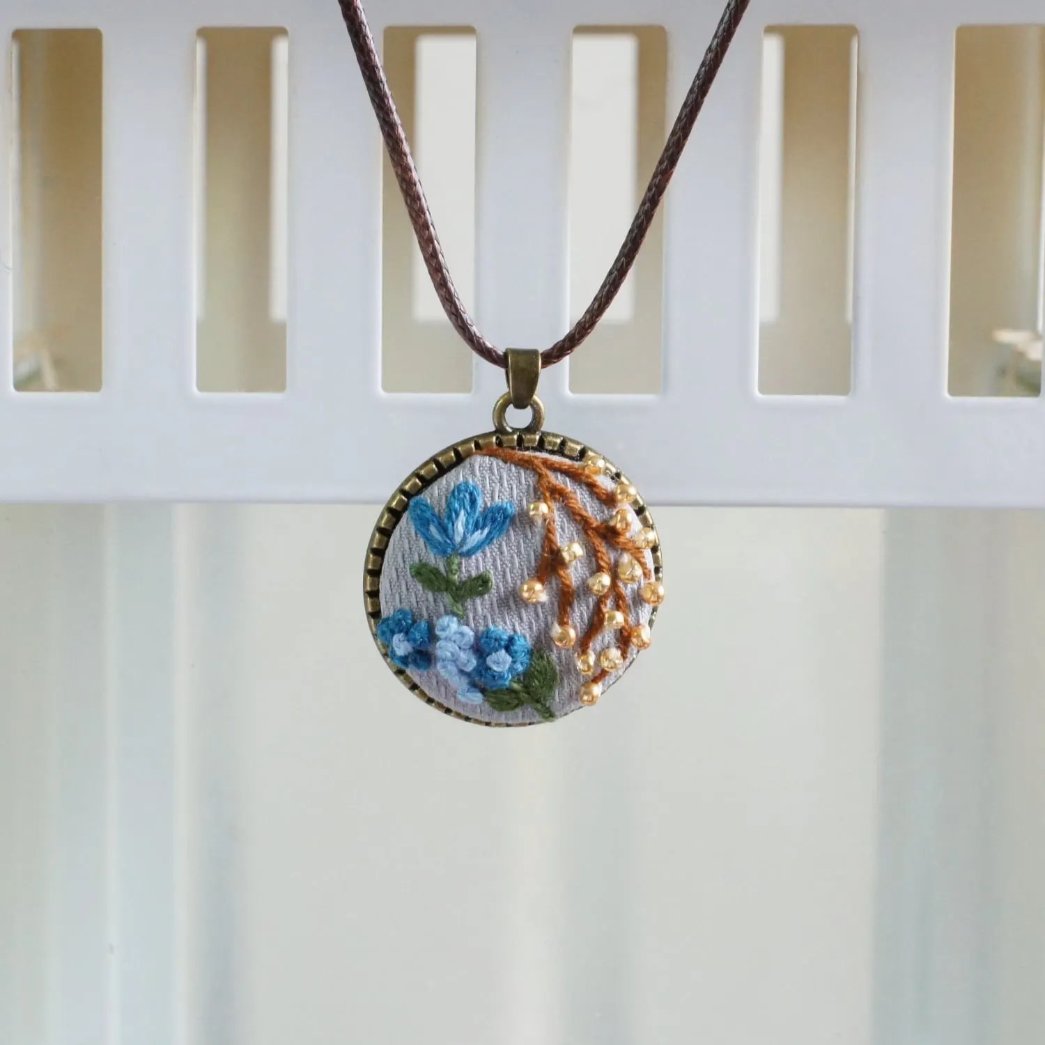 beaded embroidered floral pendant