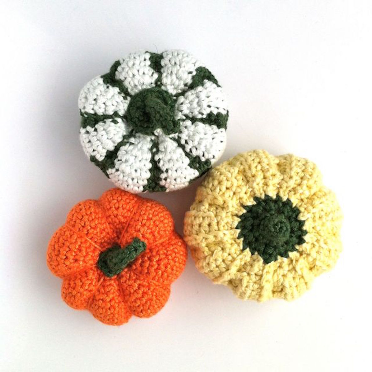 Picture of hand-crocheted pumpkins in a variety of colours