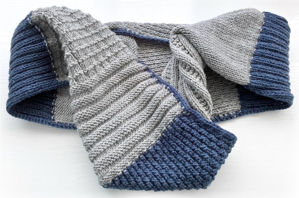 Knit infinity scarf in style of a sampler of different stitches