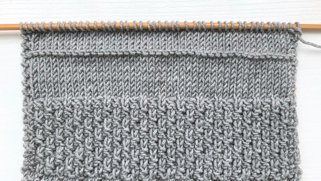Different knitting stitches on a bamboo knitting needle