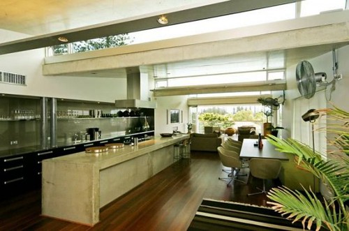 Clustered globe pendants creating vertical design interest without overwhelming the small kitchen volume.