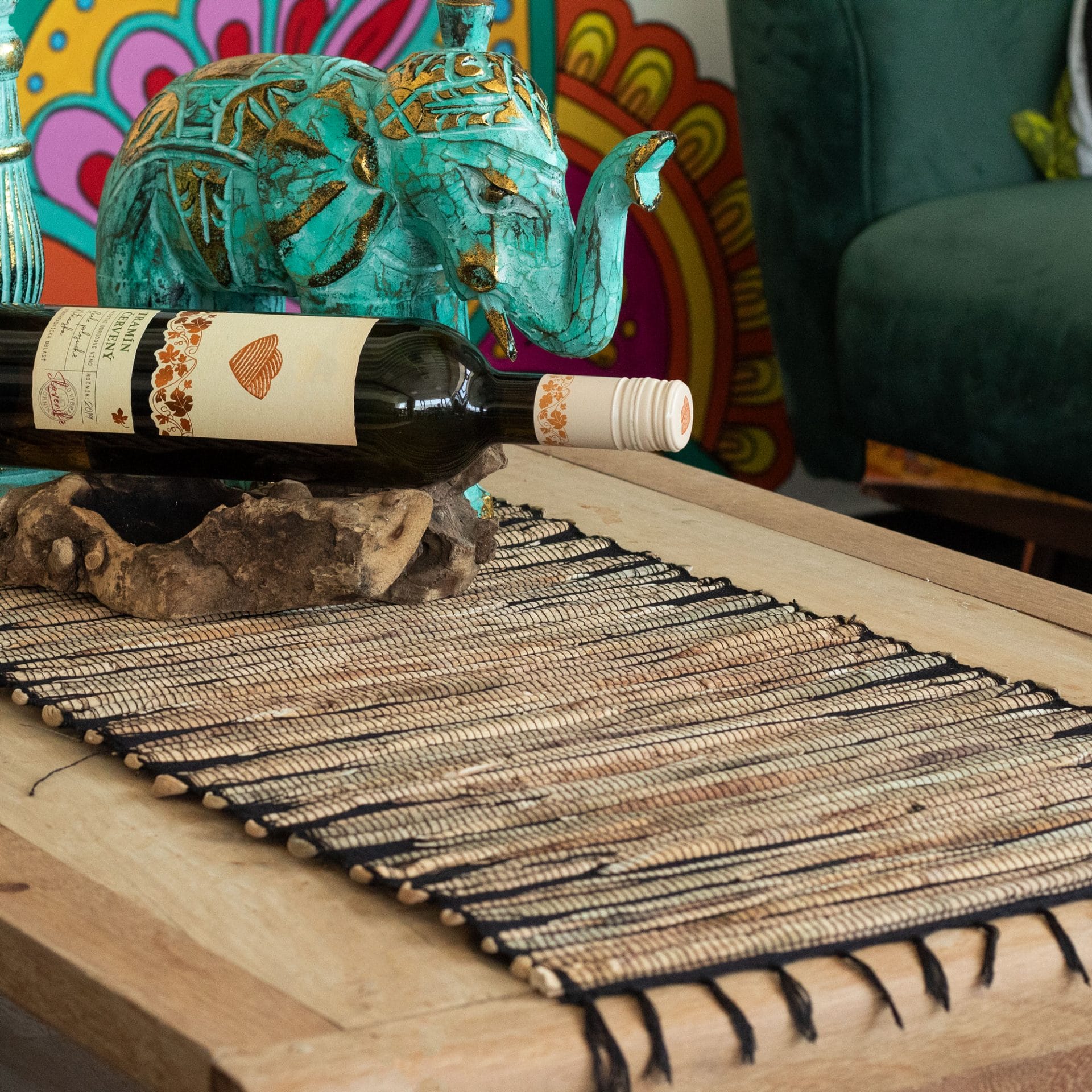 Water Hyacinth table runner with a Black Tiger pattern, displayed on a wooden table with decorative items.