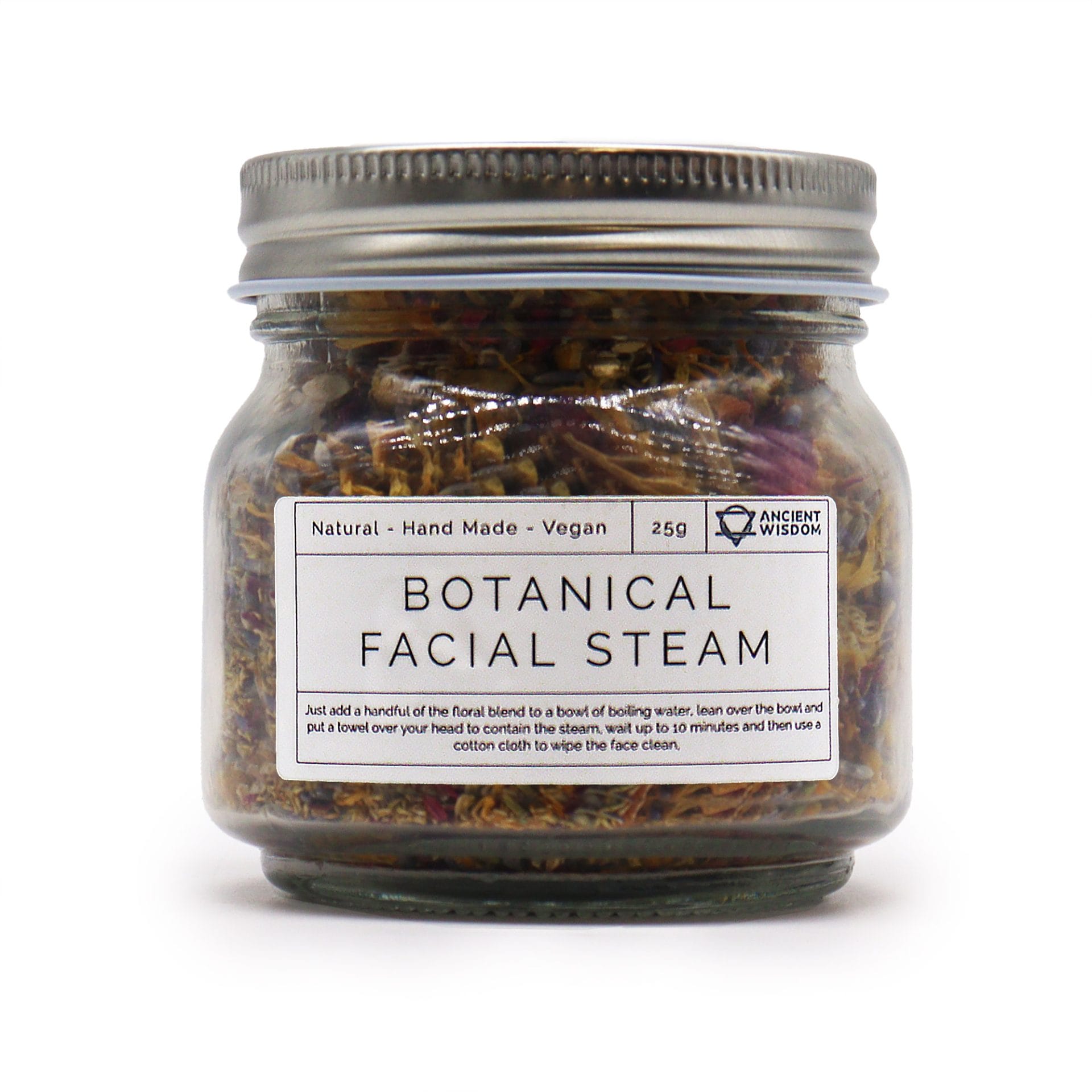 Close-up of a jar of Botanical Facial Steam with dried floral ingredients inside.