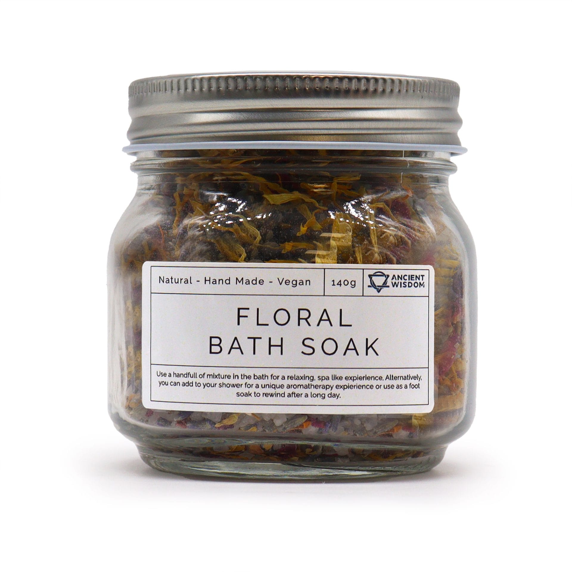 Floral Bath Soak jar filled with botanical ingredients in a glass container.