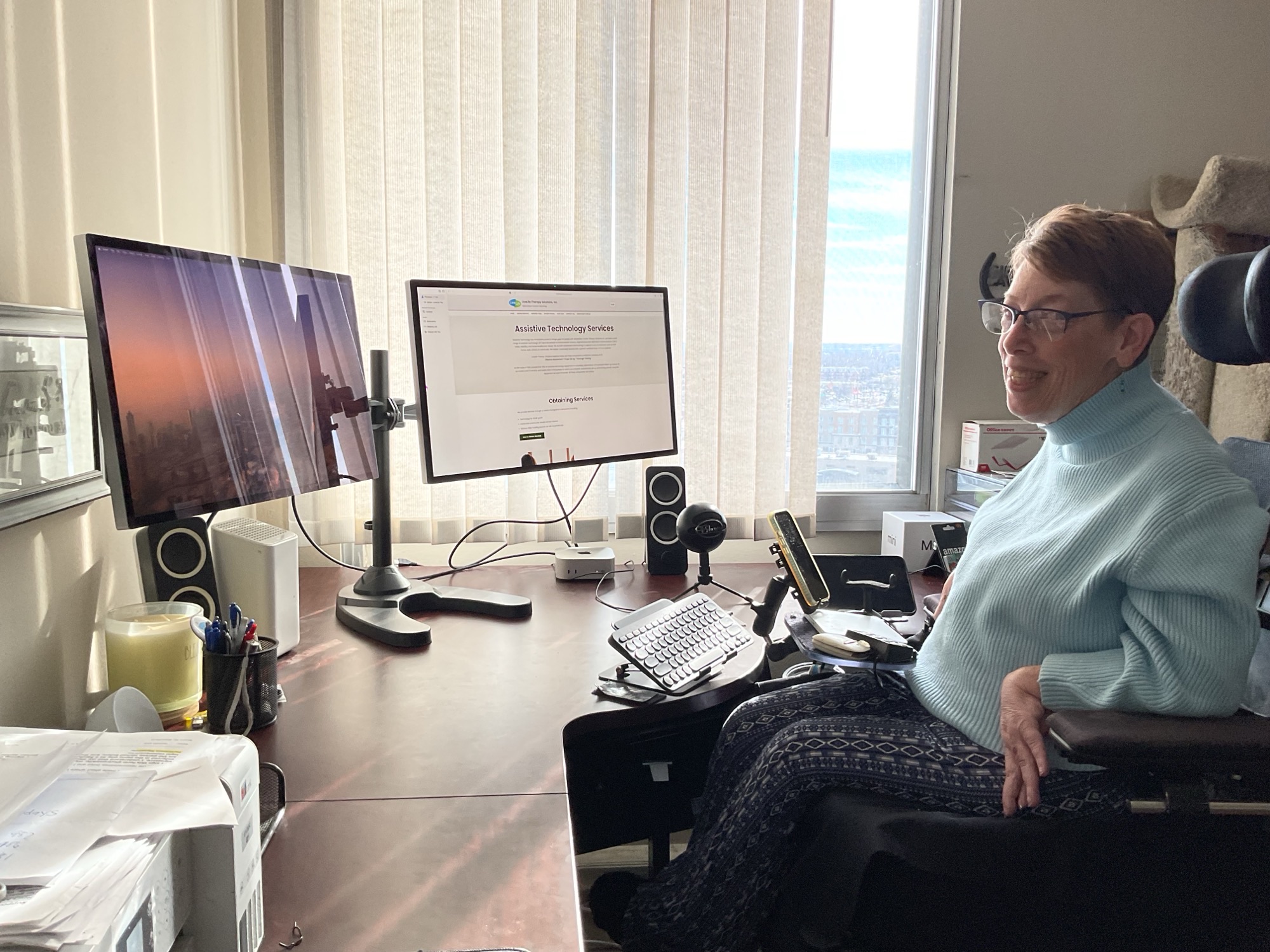 Michelle at desk with computer setup