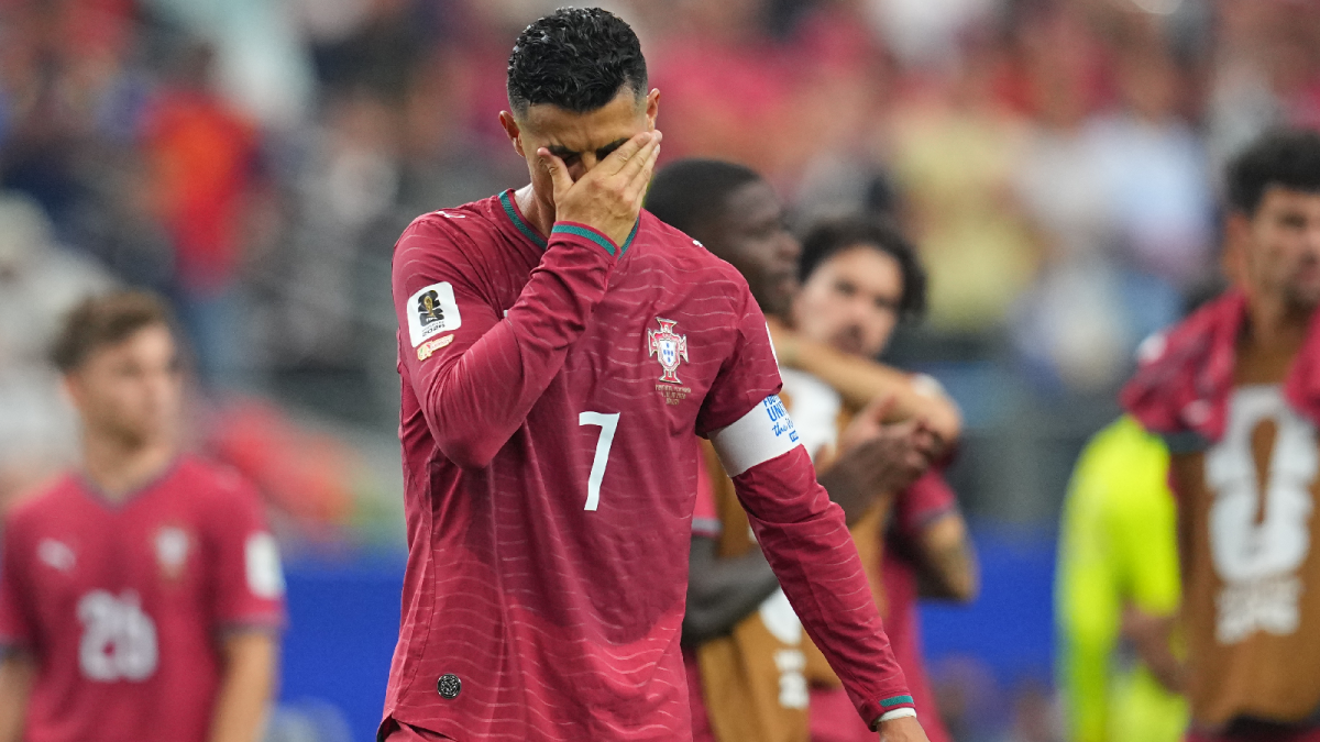 Cristiano Ronaldo Applauds Portugal Supporters After The Team'S World Cup Elimination Against Spain During His Final Fifa World Cup Appearance.