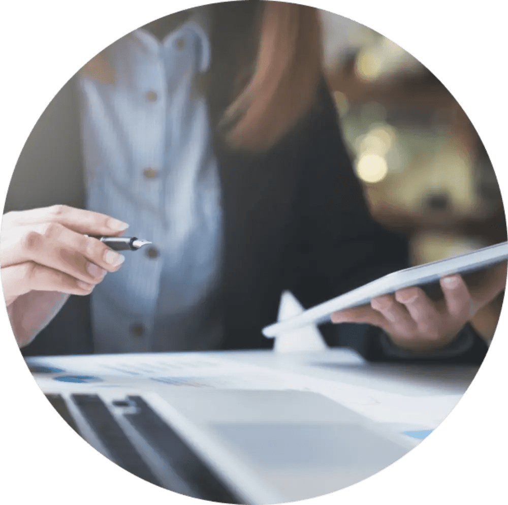 Woman holding a tablet and pen.