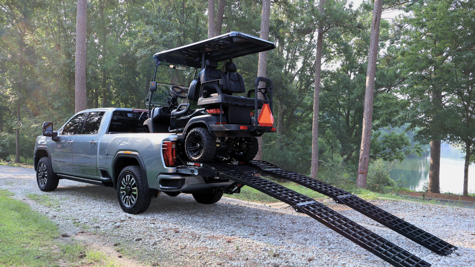 Load Pro ramp system loaded with a golf cart in a pickup truck bed