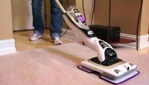 Insert proper size tool (paperclip or something similar in diameter but rigid), firmly press the button and lift the handle to remove. Let The Shark Sonic Duo Cleaning System Clean Your Floors