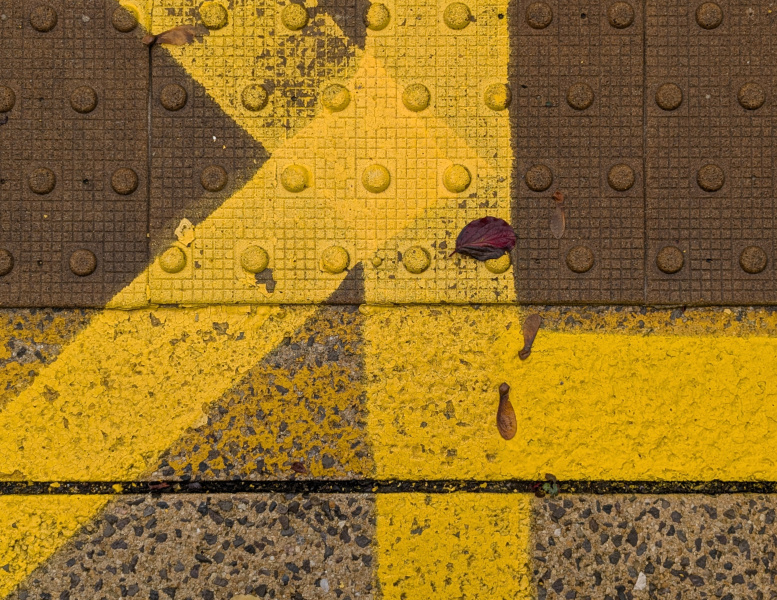 yellow lines on a station platform