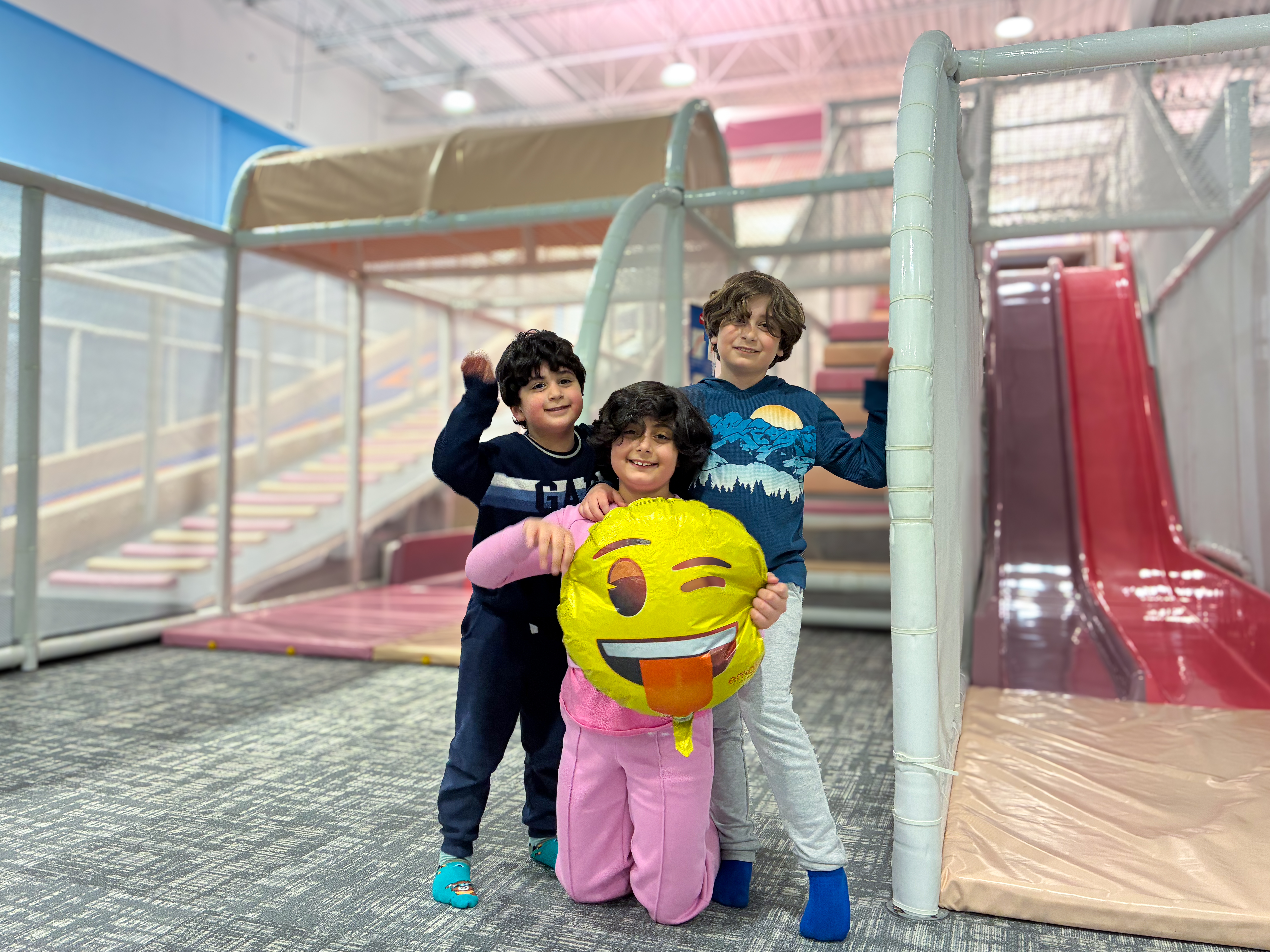 Kids playing together in the LOL PlayLab indoor playground