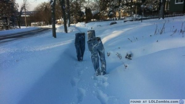 Walking down the sidewalk.