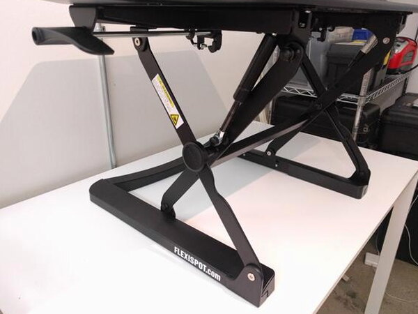 The four included cord organizers and monitor mount bolt for the FlexiSpot desk