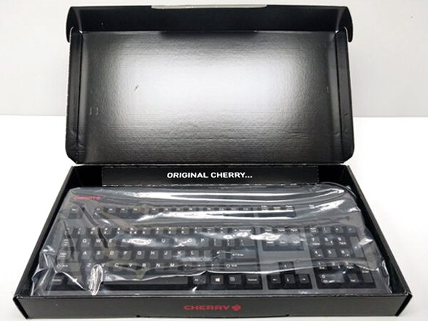 The Cherry MX Board Silent box opened, showing the keyboard sealed in plastic inside
