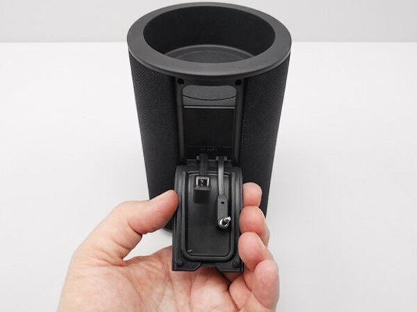 A hand holding open the connector flap at the top of the Vaux cradle