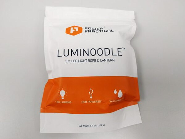 The Luminoodle sealed inside its brightly colored foil packaging bag