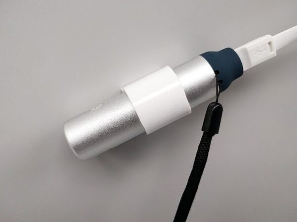 The Lithium 3400 battery pack's magnetic sleeve attached to a metal surface