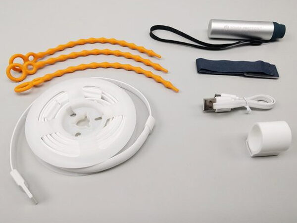 The complete Luminoodle accessory kit including ties, pouch, cable, and reel