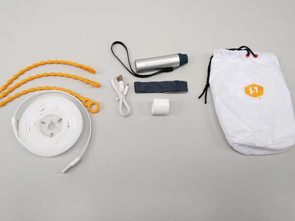 The Luminoodle light rope on its reel with mounting ties, cable, and battery accessories