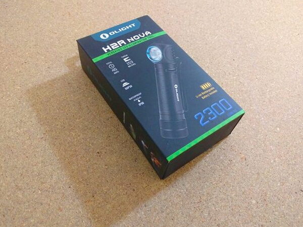 The Olight H2R Nova box viewed from the side, showing the beam and lumen rating