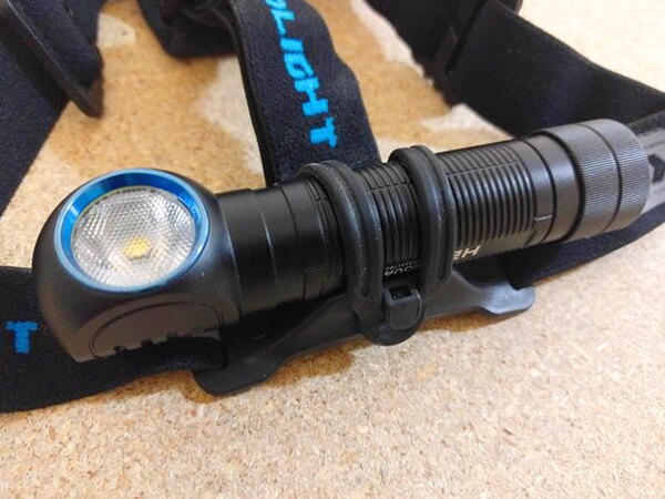 The Olight H2R Nova seated in its headstrap, not yet powered on