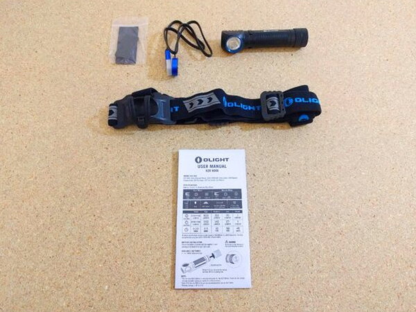 All of the H2R Nova's included accessories laid out: headstrap, pad, lanyard, light, and manual