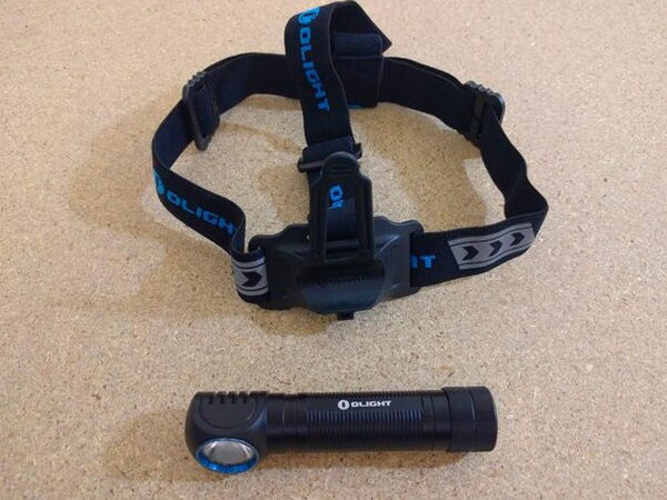 The Olight H2R Nova headstrap and the light itself laid out side by side before mounting