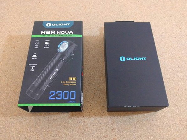 The printed outer sleeve next to the plain black inner box